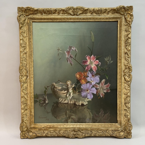 150 - Evans mid 20th Century still life of lilies held in a vase with cherub mount, oil on canvas, signed ... 