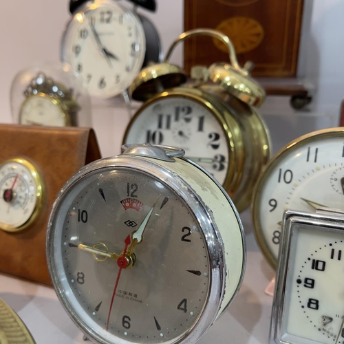 90 - An inlaid Edwardian mantel clock together with a quantity of other later clocks