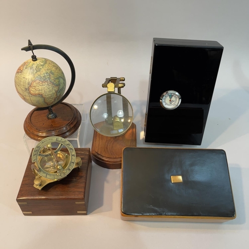 139 - A reproduction West London brass sundial and compass in walnut case, a Germanus humidor, a small rep... 