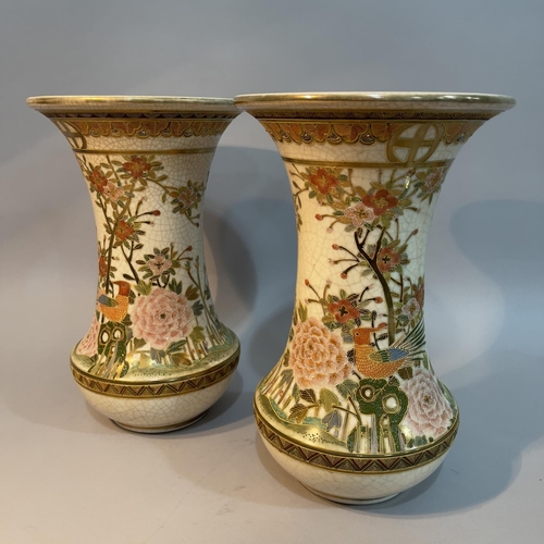 38 - A pair of Japanese early 20th century flared rim vases, having gilt and enamel decoration of birds  ... 