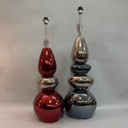 73 - Two pebble tower floor lamps in silver and pewter and in ruby and silver (one pebble cracked) chrome... 