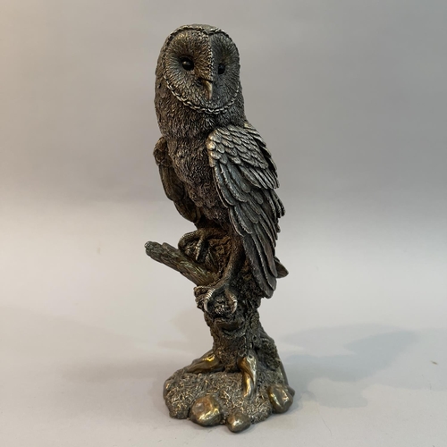 29 - A filled white metal (tests as silver) model of a Barn Owl by Country Artists, modelled on a branch,... 