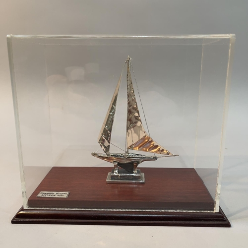 179 - A white metal model of a Greek Yacht in sale with rigging, marked silver 950 and tests as silver, in... 