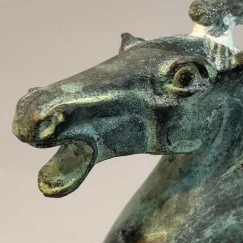 34 - A bronze Han dynasty style model of the Flying Horse of Kangxai, 16cm high, with damages