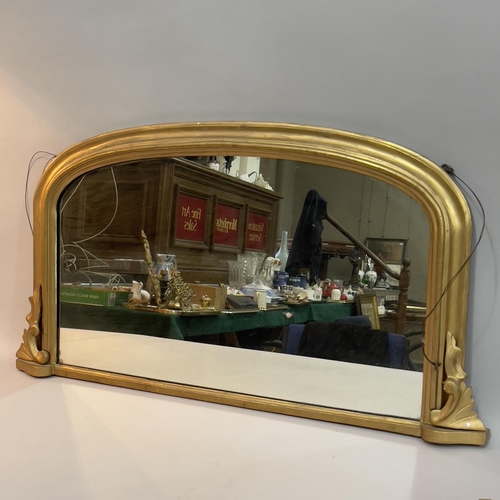 235 - A gilt over mantel mirror with c scrolls 93cm wide