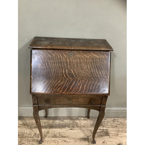 240 - An early twentieth century oak drop front bureau with fitted interior on cabriole legs