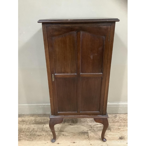 242 - A Victorian mahogany cupboard the interior fitted with shelving on cabriole legs, 53cm wide