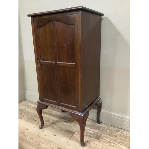 242 - A Victorian mahogany cupboard the interior fitted with shelving on cabriole legs, 53cm wide