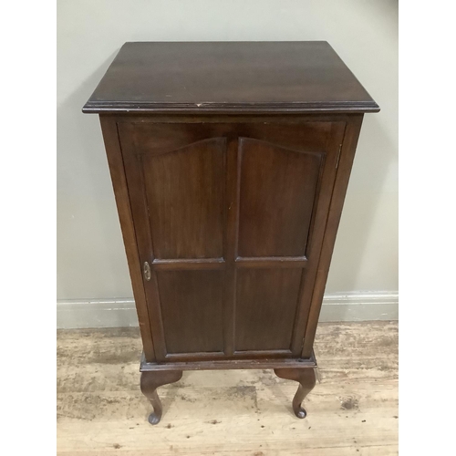 242 - A Victorian mahogany cupboard the interior fitted with shelving on cabriole legs, 53cm wide