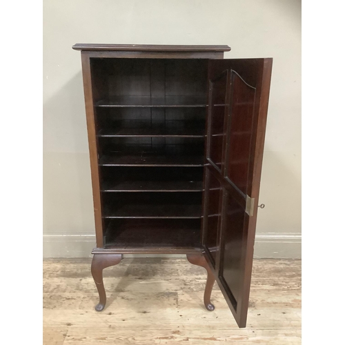 242 - A Victorian mahogany cupboard the interior fitted with shelving on cabriole legs, 53cm wide