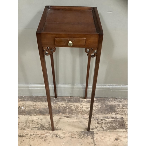 243 - An 18th century style teapot stand with slide to the freize, on square legs  79cm high