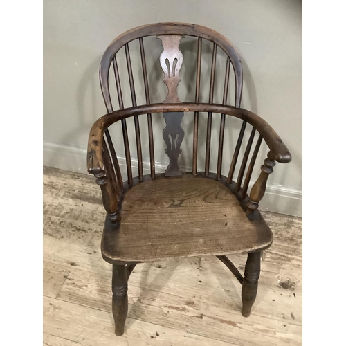 279 - An elm Windsor chair with spindle and splat back on turned cut-down legs