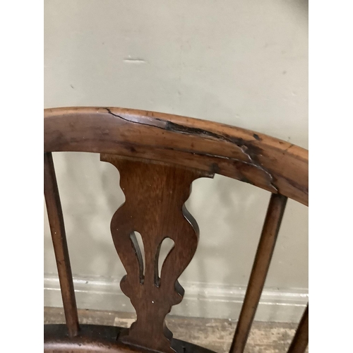 279 - An elm Windsor chair with spindle and splat back on turned cut-down legs