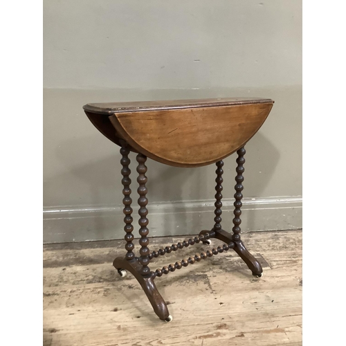 281 - A mahogany drop leaf occassional table on bobbin legs and stretcher