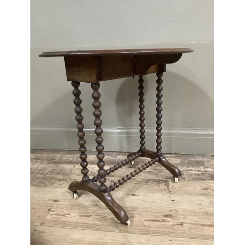 281 - A mahogany drop leaf occassional table on bobbin legs and stretcher