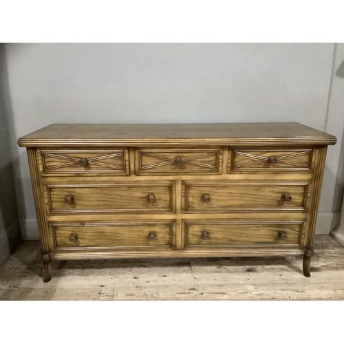 283 - An elm continental style bedroom suite comprising of a dressing chest with three short over four lon... 