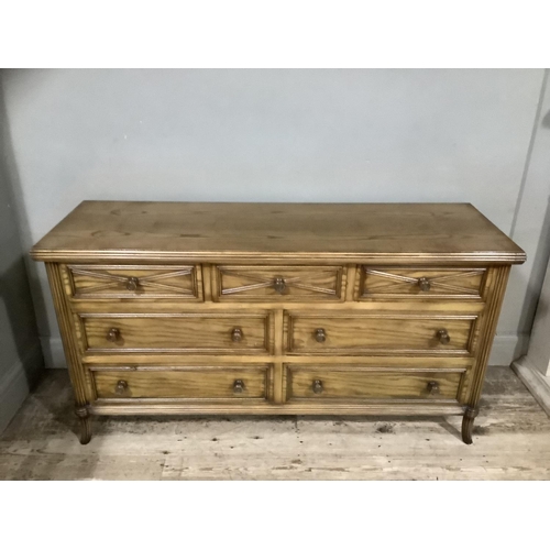 283 - An elm continental style bedroom suite comprising of a dressing chest with three short over four lon... 