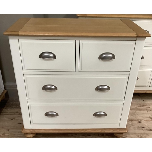 284 - A Cotswold beech bedroom suite painted off white, with a bank of four short above four long drawers ... 