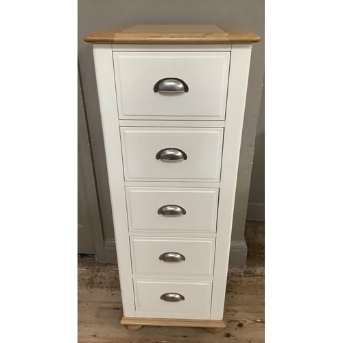 284 - A Cotswold beech bedroom suite painted off white, with a bank of four short above four long drawers ... 