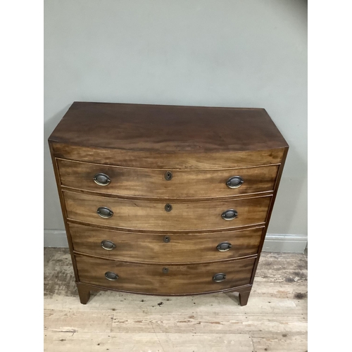 244 - A Victorian mahogany bow fronted chest of four long drawers with brass escutcheons on bracket feet, ... 