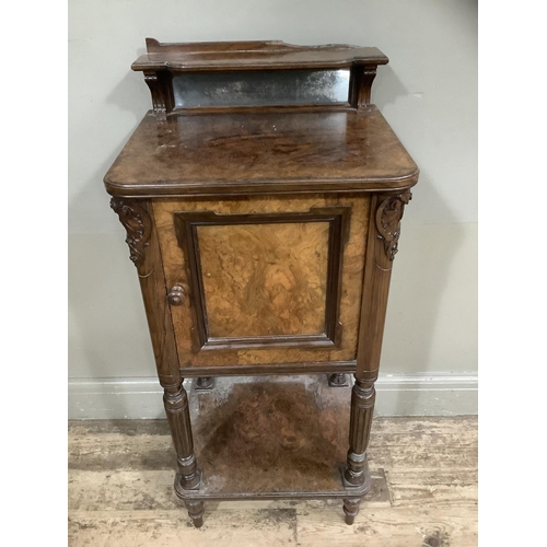 249 - A Victorian walnut  pot cupboard with mirrored back, carved sides, with column supports and under ti... 