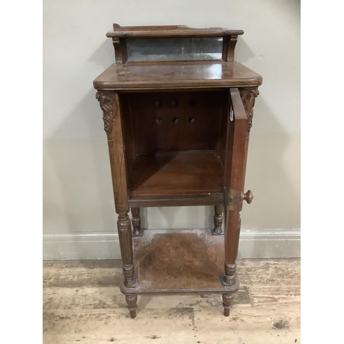 249 - A Victorian walnut  pot cupboard with mirrored back, carved sides, with column supports and under ti... 