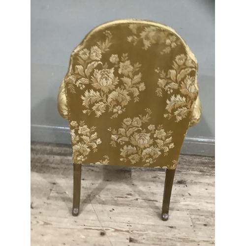 253 - A George III style walnut armchair on cabriole legs upholstered in gold fabric