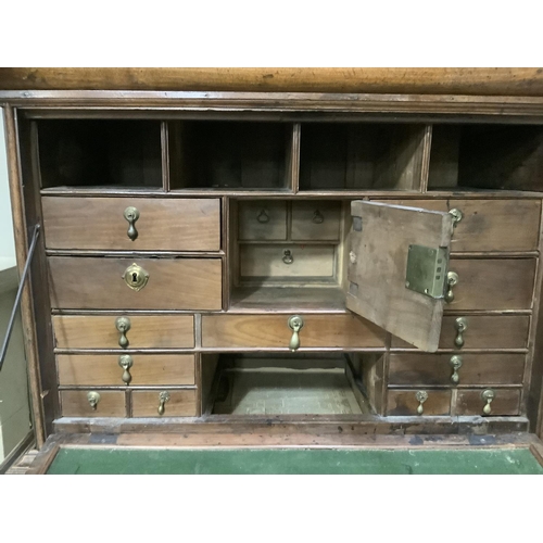 254 - A 19th century continental mahogany secretaire abbatant with drop down fall having a fitted interior... 