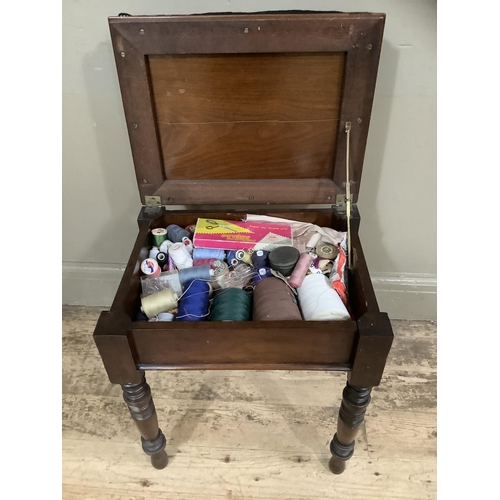 264 - A mahogany piano stool converted to a sewing box on turned legs with contents