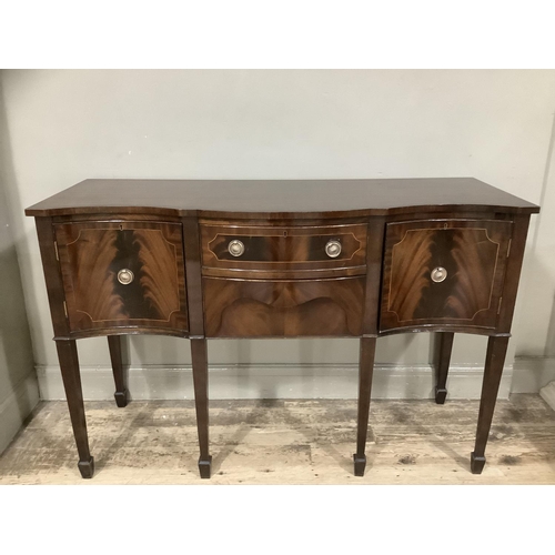 269 - A reproduction mahogany satinwood inlaid sideboard serpentine fronted, two drawers to the centre fla... 