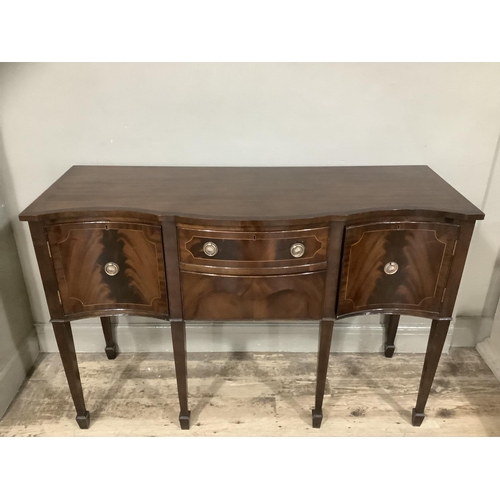 269 - A reproduction mahogany satinwood inlaid sideboard serpentine fronted, two drawers to the centre fla... 