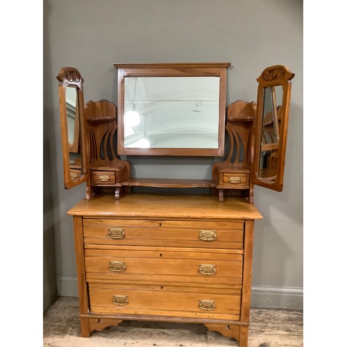 229 - A Victorian satinwalnut triple mirrored dressing table having pierced sides with three drawers on br... 