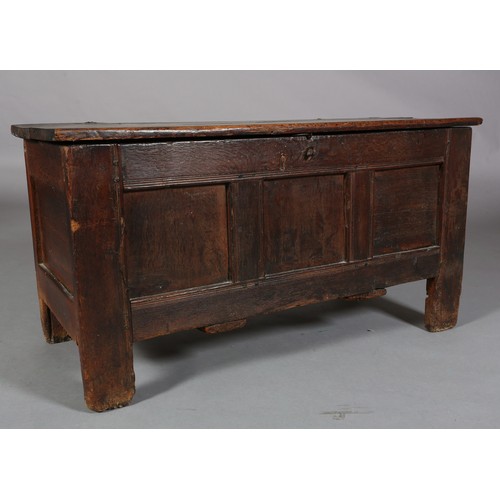 231 - AN EARLY 18TH CENTURY OAK JOINED CHEST, having a planked top above a triple indented panel front, pl... 