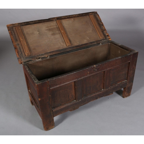 231 - AN EARLY 18TH CENTURY OAK JOINED CHEST, having a planked top above a triple indented panel front, pl... 