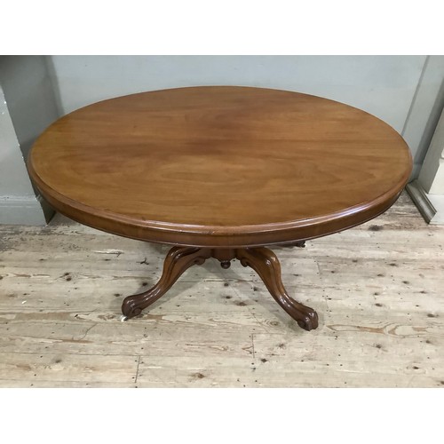 272 - A mahogany Victorian oval topped Looe table on carved baluster support on four carved legs with cast... 