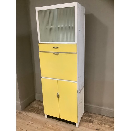 74 - A mid century yellow formica kitchen table with a glazed unit above drop down cupboard