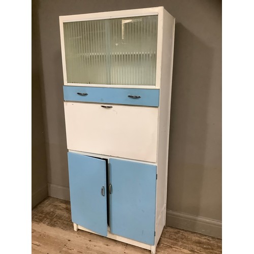 76 - A mid century blue formica kitchen cabinet with glazed unit an drop down front