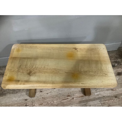 246 - A bleached oak coffee table with stretcher on twin supports, 90cm wide