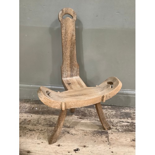 248 - A carved beech spinning chair on splayed legs