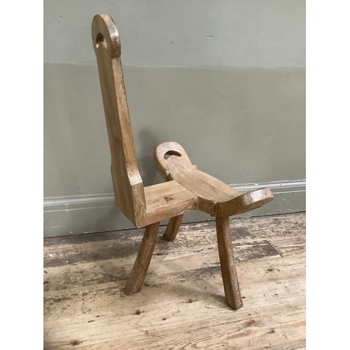 248 - A carved beech spinning chair on splayed legs