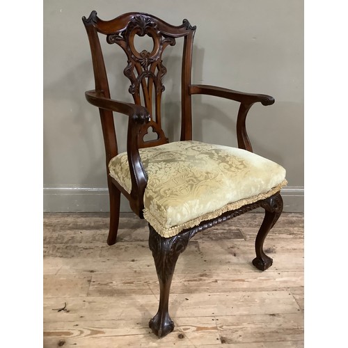 270 - A mahogany Chippendale style carver chair with pierced back, scroll arms and carved cabriole legs on... 