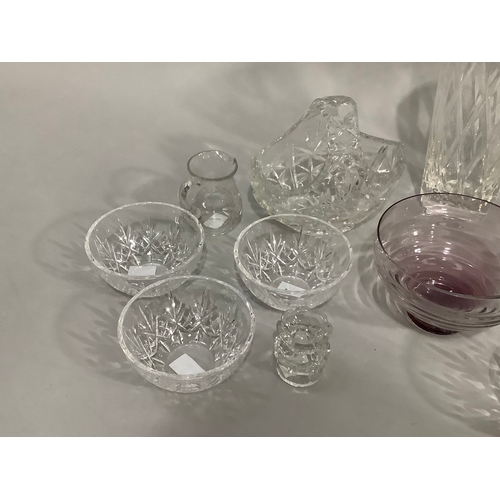 49 - A Caithness amethyst glass bowl on foot,cut glass vases, trifle bowls, and other glassware