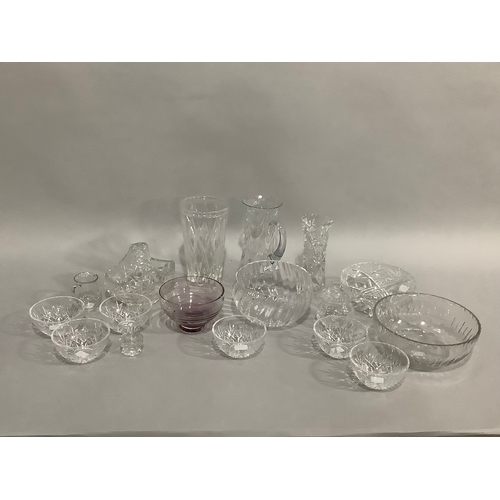 49 - A Caithness amethyst glass bowl on foot,cut glass vases, trifle bowls, and other glassware