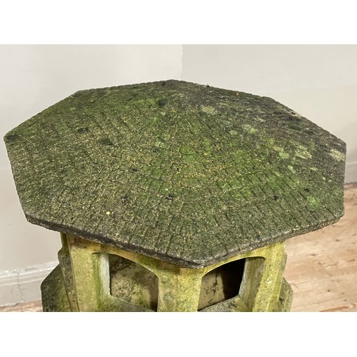 286 - A cast stone garden bird house on column, 125cm high