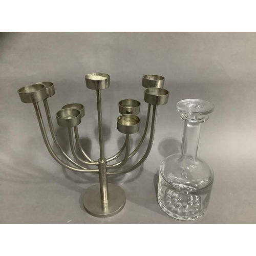 24 - A retro nine armed chrome candelabra together with a modern decanter