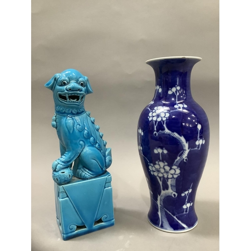 27 - A Chinese ceramic figure of a dog of fo in a turquoise glaze and a blue and white baluster vase pain... 