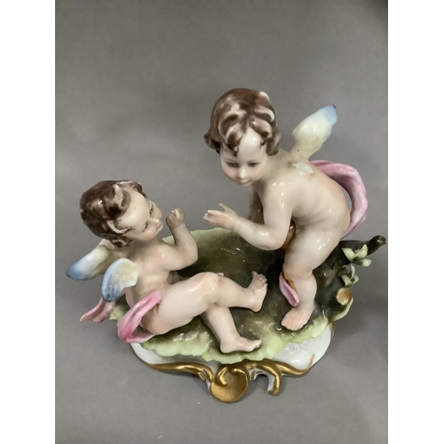 89 - A Capodimonte figure of a huntsman and his dog, with sticker to base Guiseppe Chiaruto, another two ... 