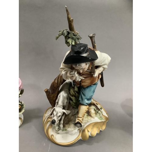 89 - A Capodimonte figure of a huntsman and his dog, with sticker to base Guiseppe Chiaruto, another two ... 