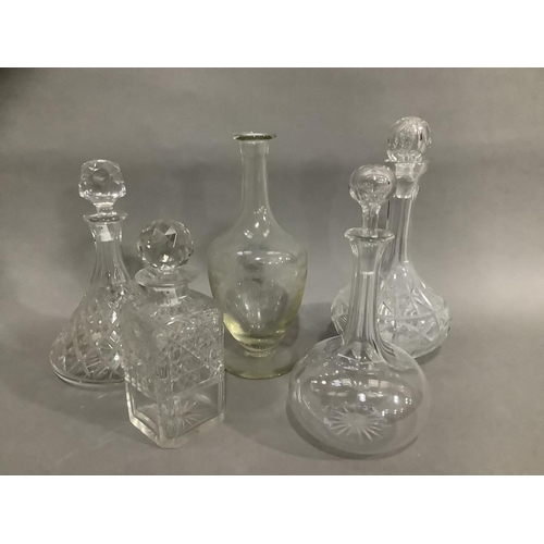 103 - A ship's decanter, an etched decanter, a square form whisky decanter and two others