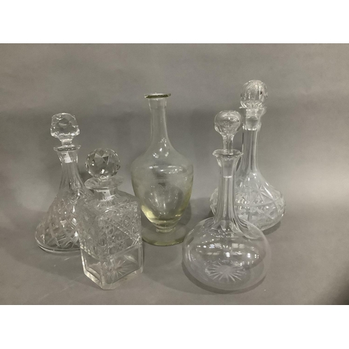 103 - A ship's decanter, an etched decanter, a square form whisky decanter and two others